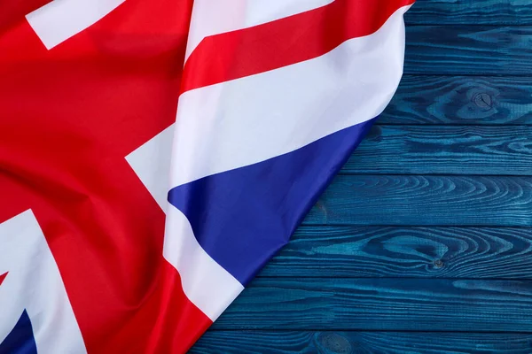 Bandera Británica Sobre Mesa Madera Azul —  Fotos de Stock