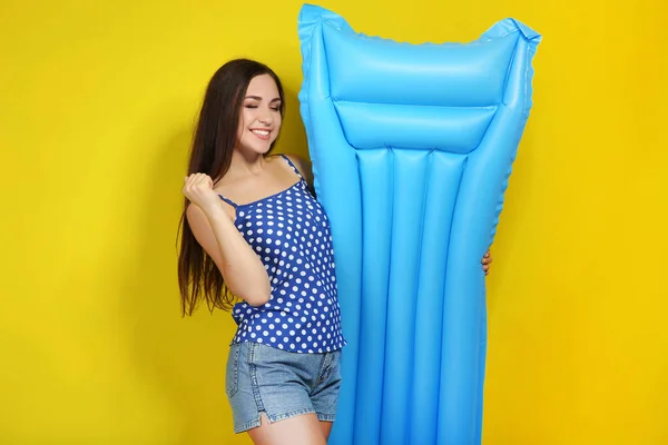 Young Girl Inflatable Mattress Yellow Background — 스톡 사진