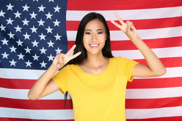 Young woman on American flag background