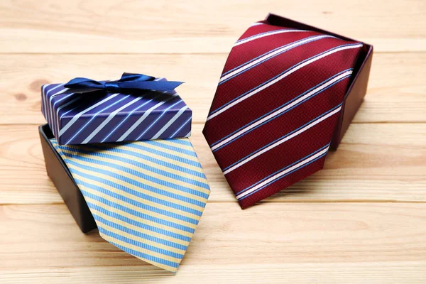 Striped Neckties Boxes Brown Wooden Table — Stock Photo, Image