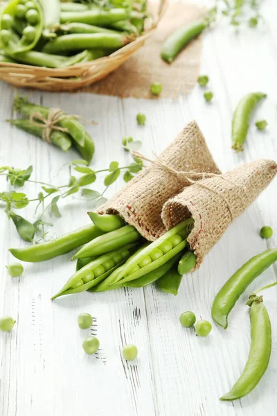 Green Pea Pods Sackcloth White Wooden Table — Stock Photo, Image