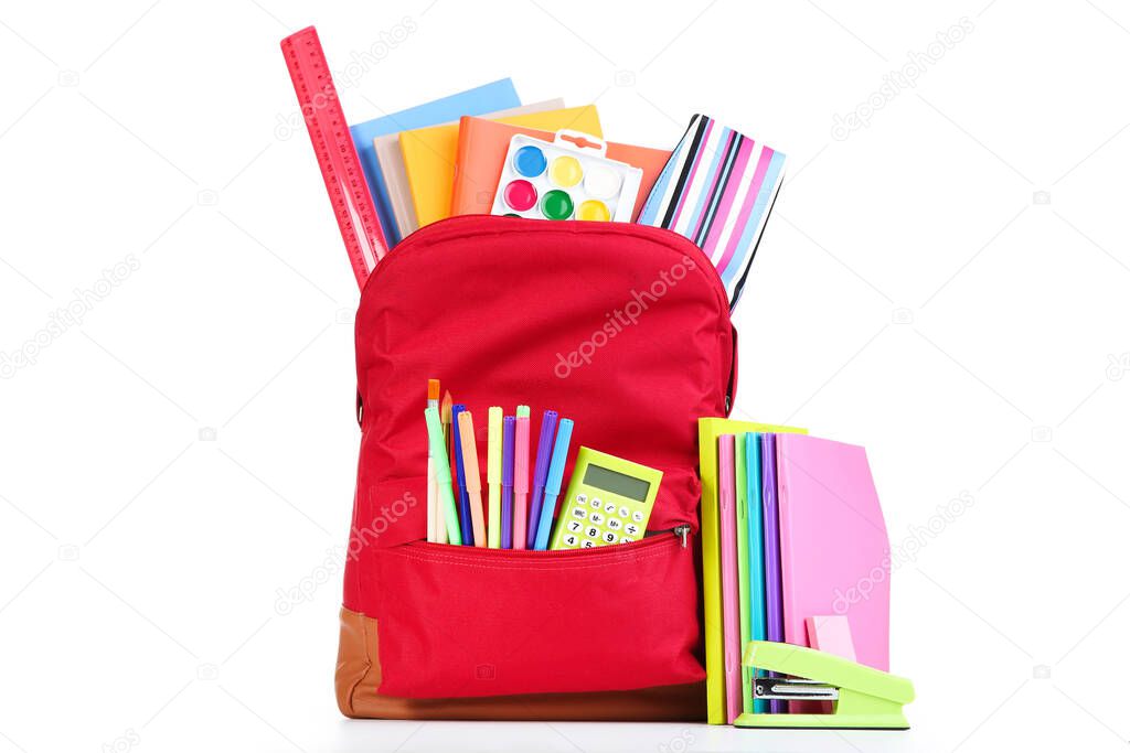 Backpack with school supplies isolated on white background