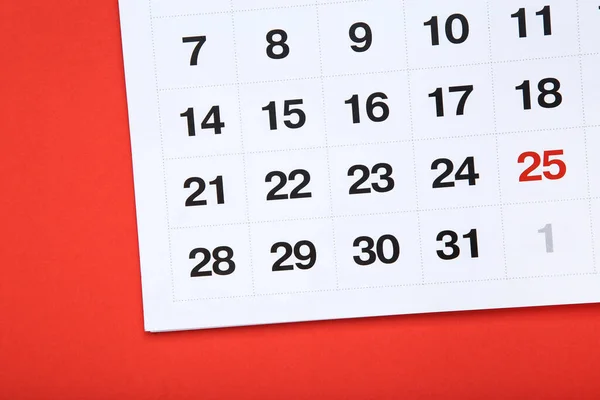 Paper calendar page on red background