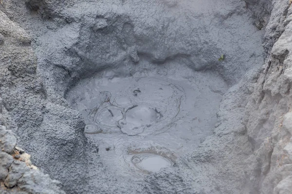 Mud bubbling in a hole at the geothermal active area of Hverir in Iceland Fumarole field of — Stock Photo, Image