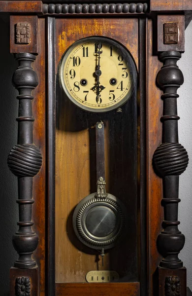 old wood pendulum clock