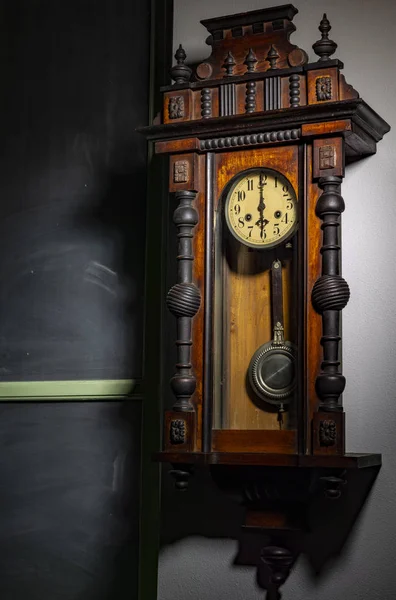 old wood pendulum clock