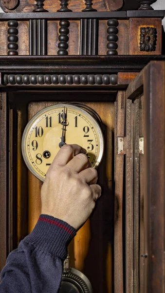 old wood pendulum clock