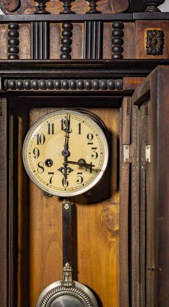 old wood pendulum clock