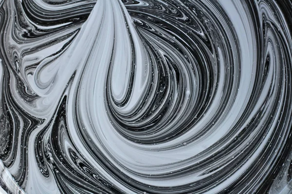 iki renk soyut görüntü karıştırma. Beyaz ve siyah boya dairelerinin dokusu