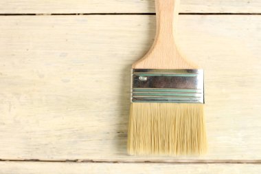 Eski beyaz vintage ahşap tahta masa üzerinde boya fırçası. Metin veya logo için yer