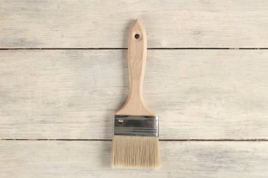 Eski beyaz vintage ahşap tahta masa üzerinde boya fırçası. Metin veya logo için yer