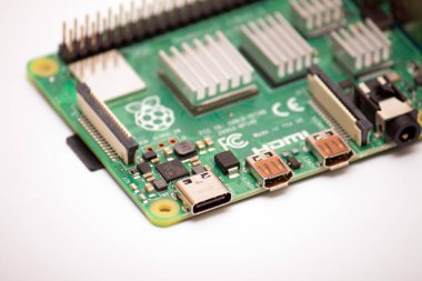 Kiev, Ukraine - August 13th, 2020: Focused image of USB-C (formally known as USB Type-C) 24-pin USB connector system with a rotationally symmetrical connector on Powered single-board microcomputer Raspberry Pi 4B clipart