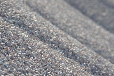 Breakstone geçmişi. Yol çakılları. Çakıl dokusu. Ezilmiş çakıl zemini. Kireç taşı yığınları. İnşaat alanında taş kırmak.