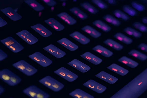 Hi tech computer mechanical keyboard with backlight rgb illumination. Close up  of computer gaming accessory.