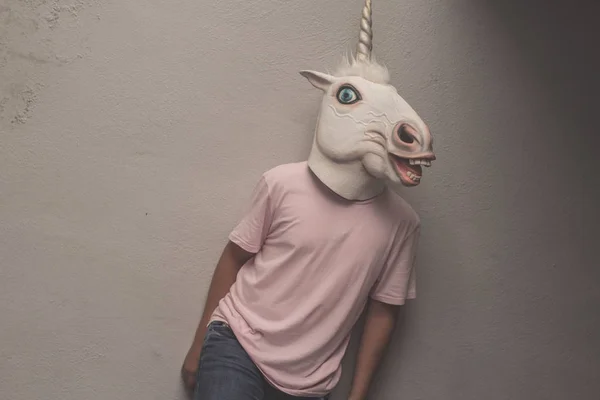 Young Man Funny Rubber Unicorn Mask — Stock Photo, Image