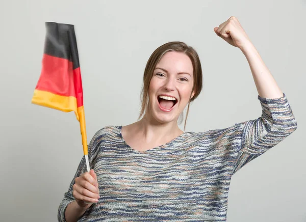 Female happy soccer fan with german flag