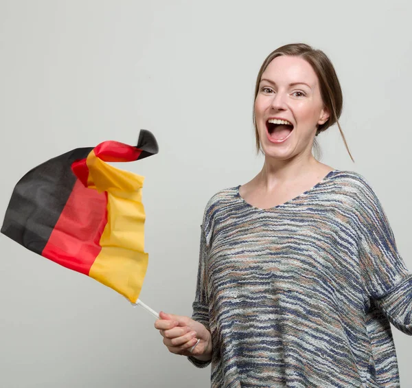 happy soccer fan with a german flag