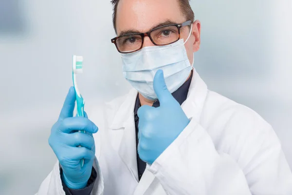 Dentist Shows Thumb Shows Tooth Brush — Stock Photo, Image