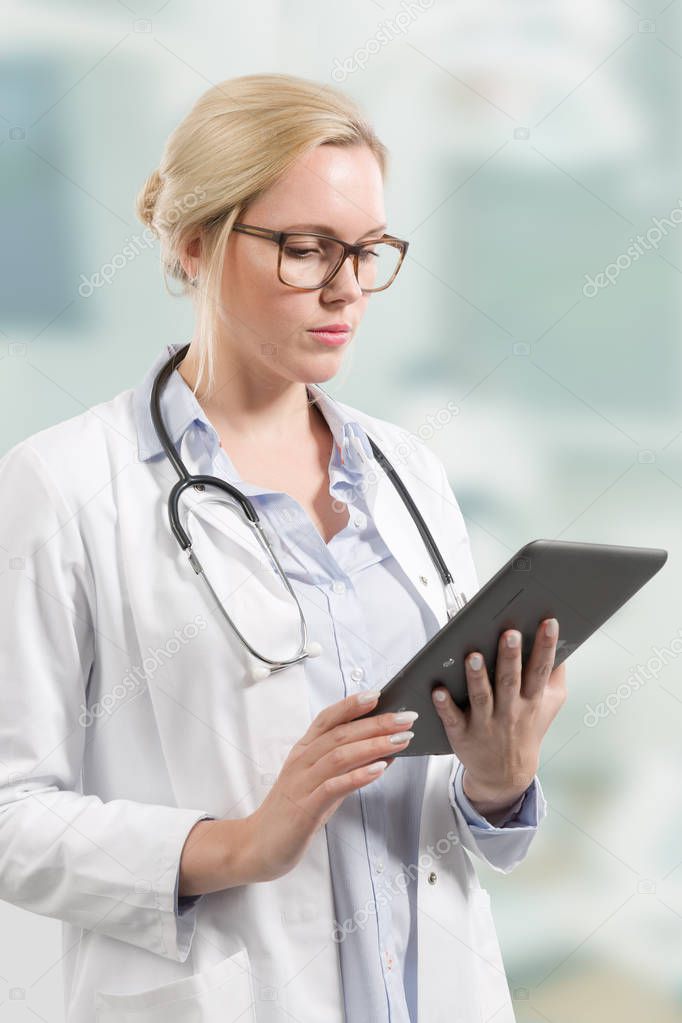 female doctor with stethoscope and clipboard