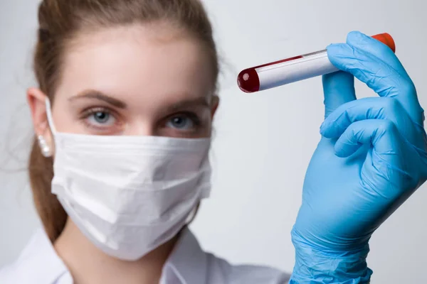 Young Woman Face Mask Shows Blood Test Tube — Stock Photo, Image