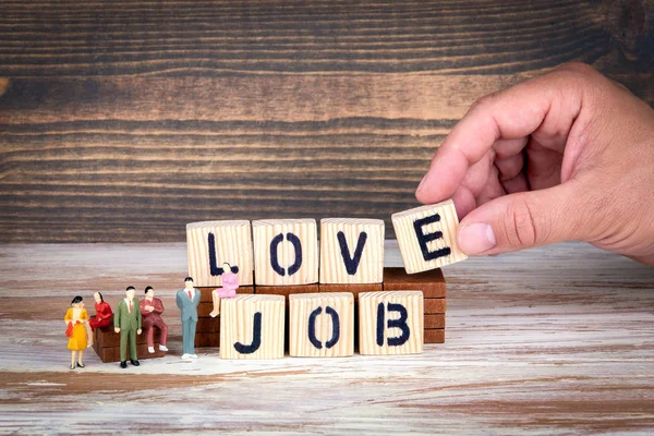 Love job, business and career. Wooden letters on the office desk