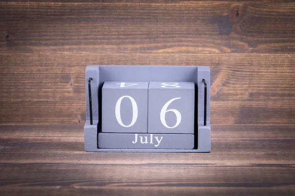 6 July. Wooden, square calendar