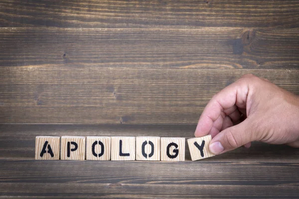 Apology. Wooden letters on the office desk — Stock Photo, Image