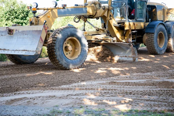 Building country road, shoveling grit with grader — Stock Photo, Image