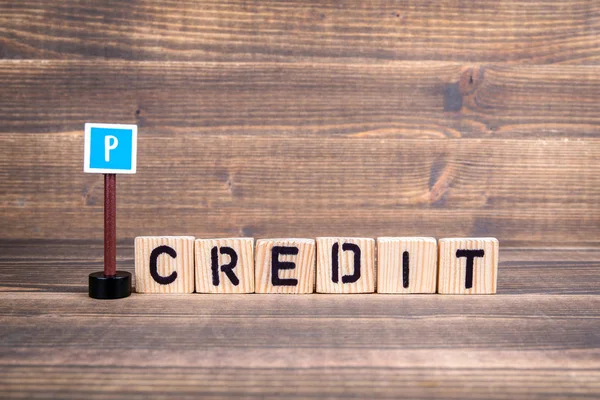 Poor Credit concept. Wooden letters with road sign — Stock Photo, Image