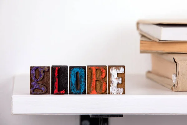 Globe word from colored wooden letters