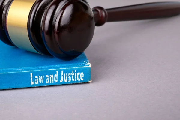 Law and justice concept. blue book on a gray office table. communication and information