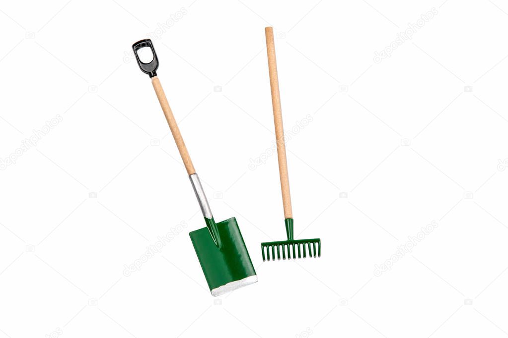 Small gardening rake and shovel isolated