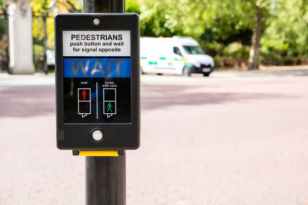 Traffic light for pedastrians in UK for safe road crossing