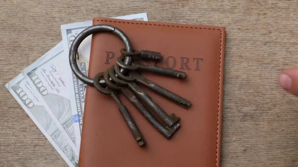 Passport, money with bunch of different keys — Stock Video