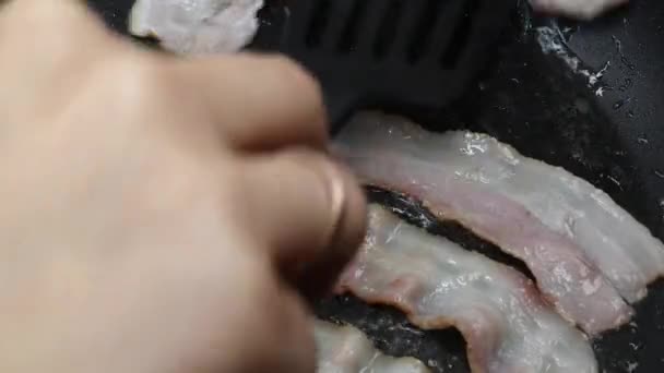 Bacon slice being cooked in frying pan — Stock Video
