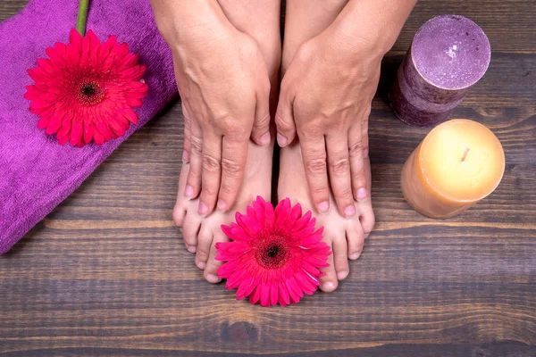 Pedicure. Womens legs and hands