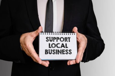 Support Local Business. Business man with a notepad