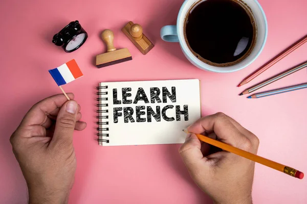 Learn French. Handwriitng text in the notebook