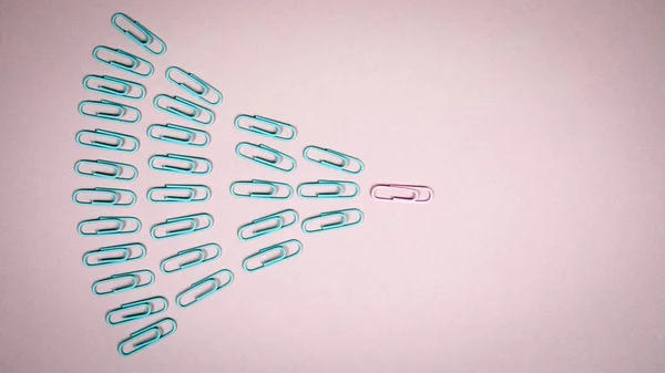 Green paper clips follow the pink paper clips