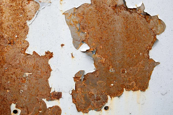 Rusty metal surface. Peeling paint. Steel with drilled holes — Stock Photo, Image