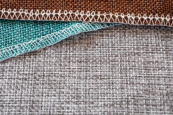 Grå, gröna och bruna textilier. Tyg för dekoration, brodyr — Stockfoto