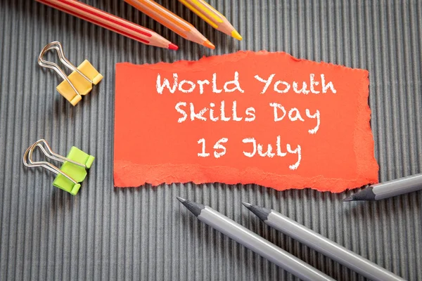 World Youth Skills Day 15 July. Text on torn, colored paper