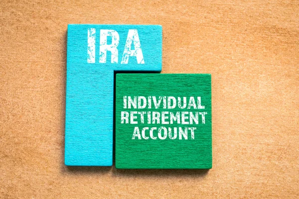 IRA. INDIVIDUAL RETIREMENT ACCOUNT concept. Colored wooden blocks, puzzle and mind game