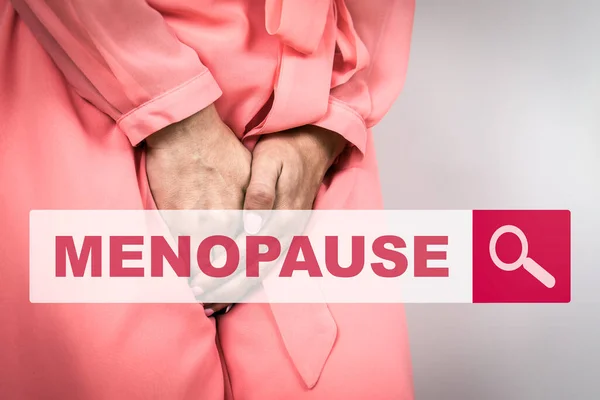 MENOPAUSE. Womans Health concept. Searching information on the Internet