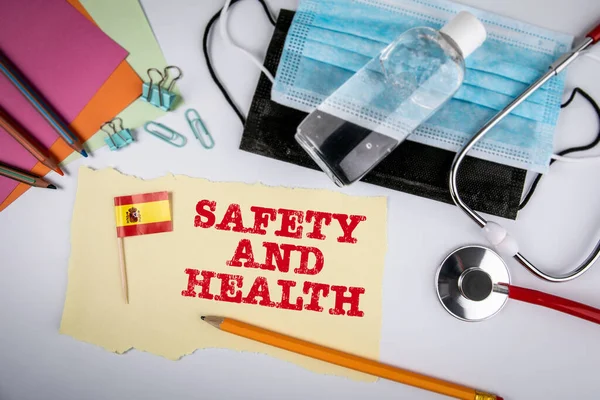 SAFETY AND HEALTH in Spain. Virus spread and security measures concept. Face masks, hand sanitizer and stethoscope