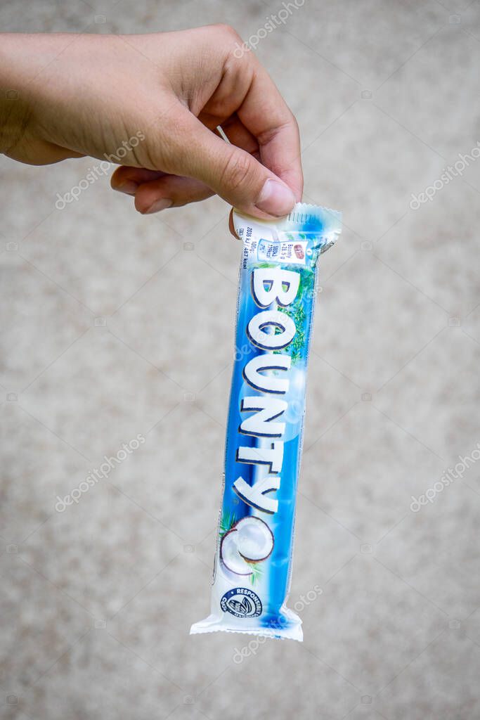 Bounty chocolate bar in hand photographed in Sigulda Latvia on August 15 2025