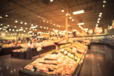 Vintage bulanıklık soyut organik taze üretir, meyve ve sebze raflarda Humble, Texas, bizi saklamak. Bulanık süper market, bakkal alışveriş müşteriler ve bokeh açık renkli