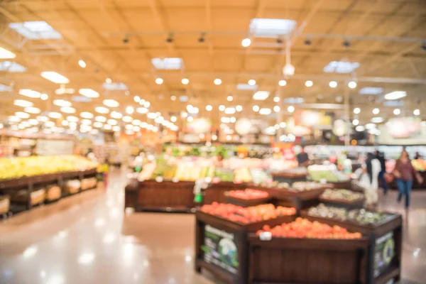 Soyut organik taze üretir bulanıklık, meyve ve sebze raflarda Humble, Texas, bizi saklamak. Bulanık süper market, bakkal alışveriş, bokeh açık renkli müşteriler ile. Sağlıklı kavramı.