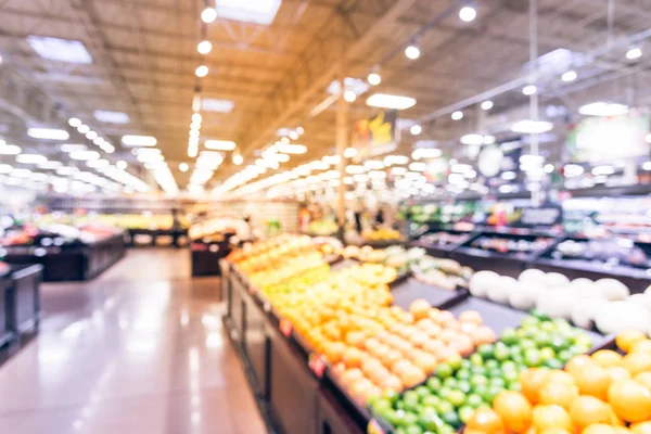 Soyut organik taze üretir bulanıklık, meyve ve sebze raflarda Humble, Texas, bizi saklamak. Bulanık süper market, bakkal alışveriş, bokeh açık renkli müşteriler ile. Sağlıklı kavramı.