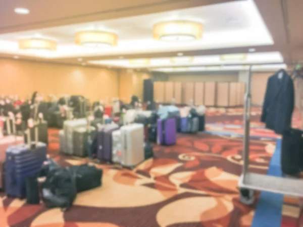 Motion blurred baggage storage room with luggage cart at luxury hotel in San Francisco, USA. Available for guests who want to leave bags. Defocused background collection of multicolor suitcase